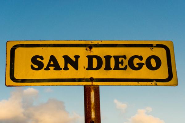 A yellow sign that says "San Diego" in black lettering